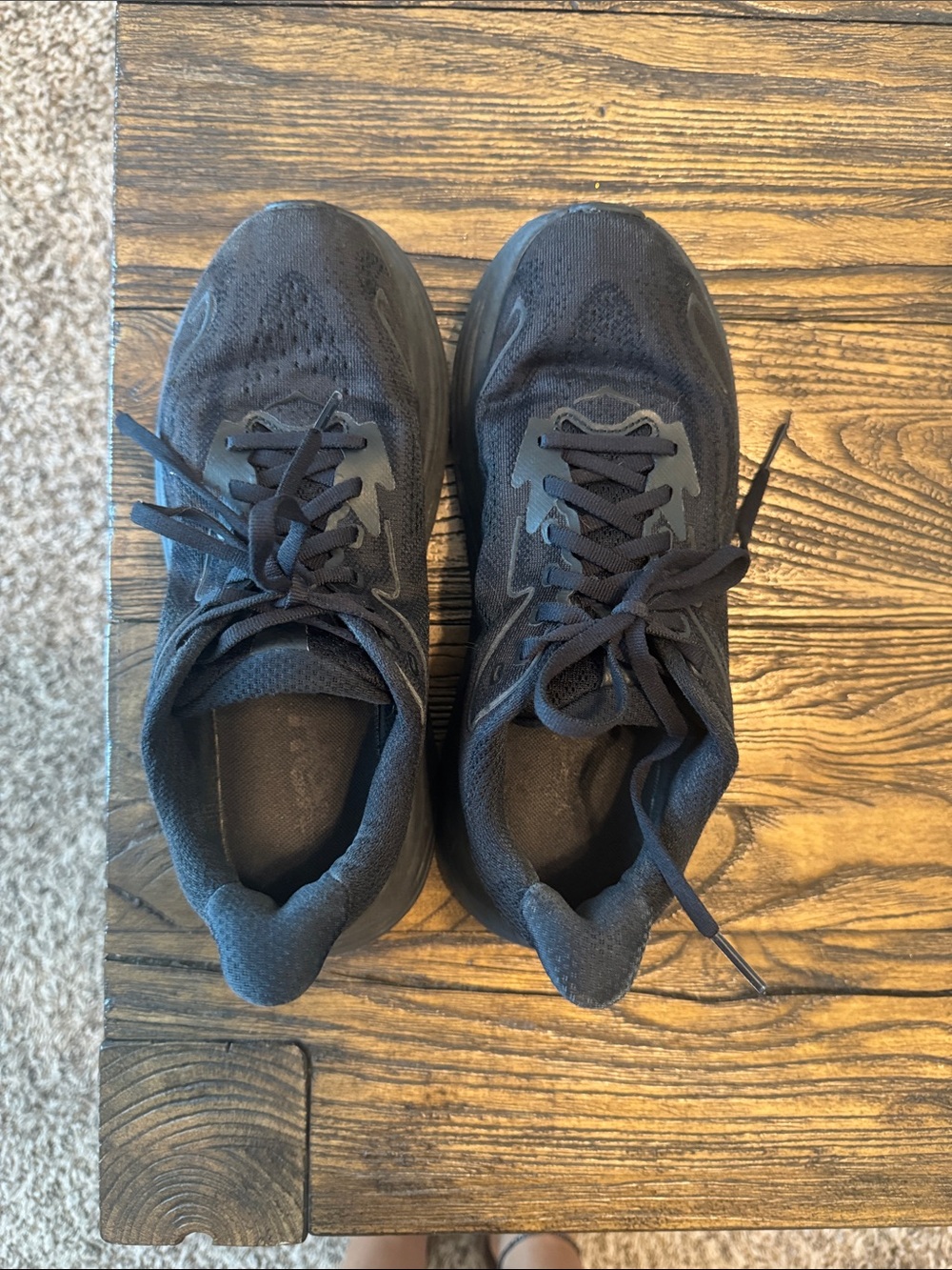Women’s black Hoka sneakers. Clifton 10